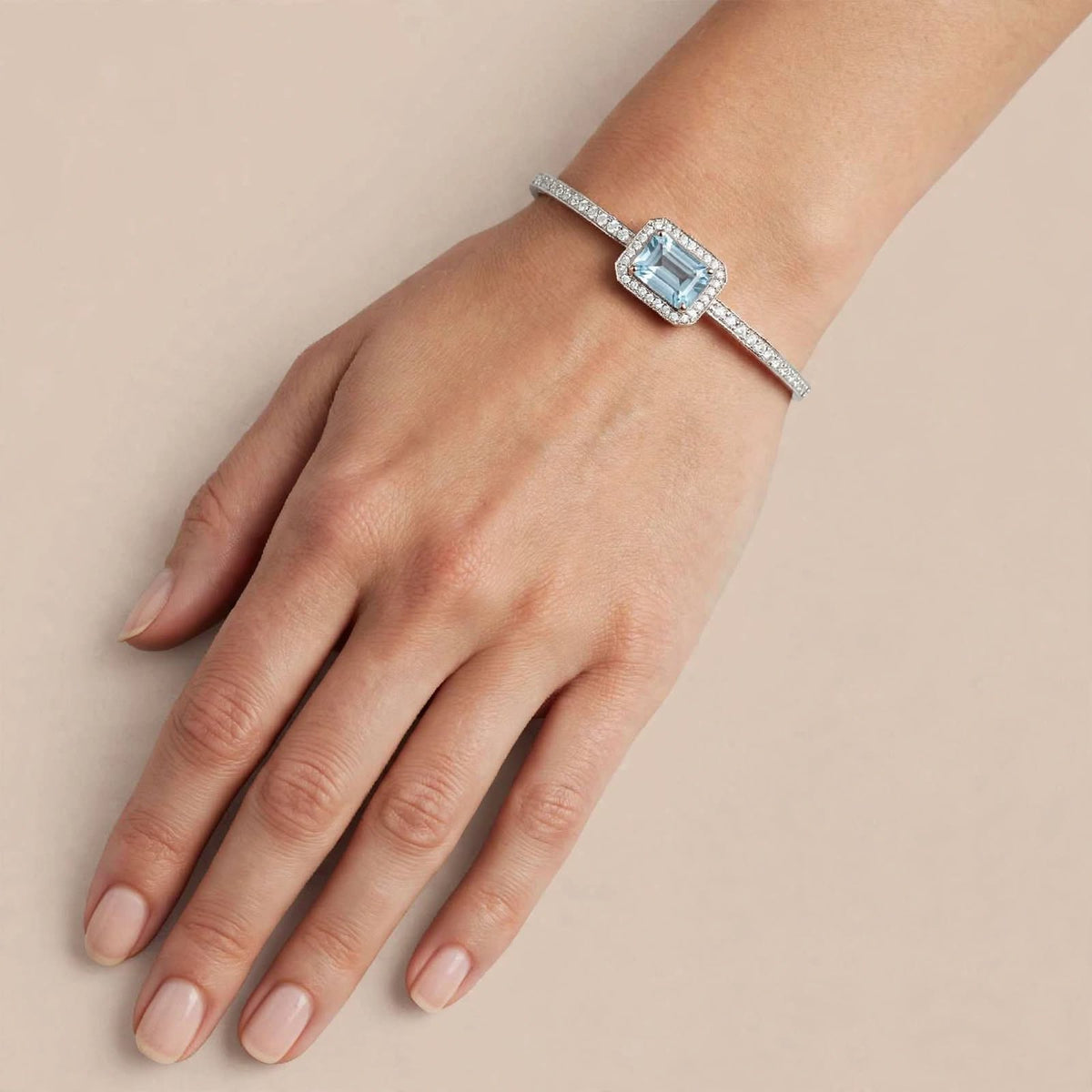 Silver Bangle Bracelet with Blue Stone and CZ Halo Detail